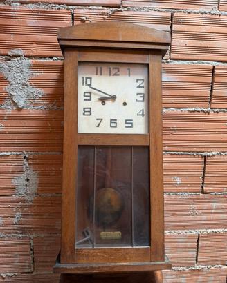 Orologio a pendolo da parete