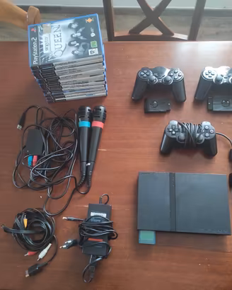 ps2 slim + kit sing star+ giochi