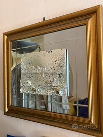 Specchi decorativi con cornice dorata