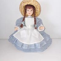 Bambolina vintage in ceramica e stoffa