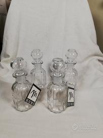 set di 4 boccette in vetro