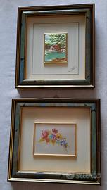 Coppia quadri su lastra in argento, cornici legno