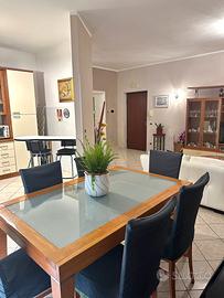 APPARTAMENTO CON BALCONI, GARAGE E POSTO AUTO