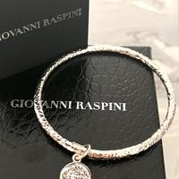 Bracciale rigido di G. Raspini con ciondolo