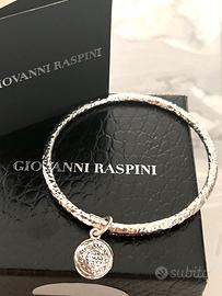 Bracciale rigido di G. Raspini con ciondolo