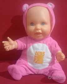 Bambolotto giocattolo che canta e ride 