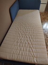 letto singolo con testata imbottita