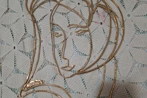 Volto laminato in oro