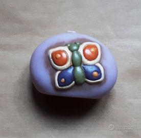 THUN farfalla candela e giocatore basket