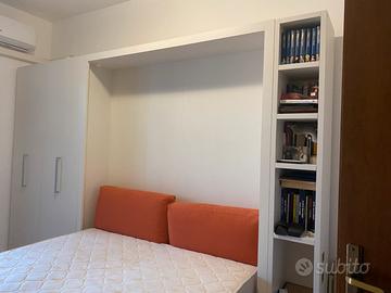 Parete attrezzata con letto a scomparsa