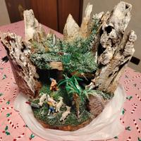 presepe su tronco con luci