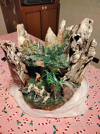 presepe su tronco con luci