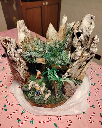 presepe su tronco con luci