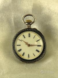 Orologio da tasca in argento nielato.