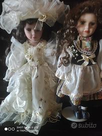 2 bambole di porcellana nuove grandi