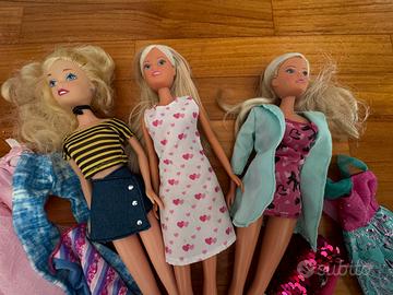 Lotto bambole tipo barbie con abiti