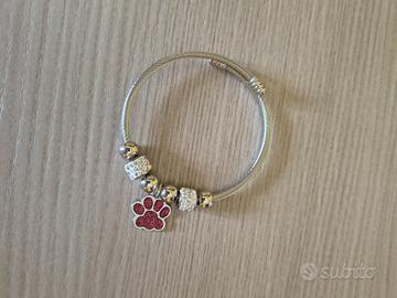 Bracciale rigido  7 charm con zampa 