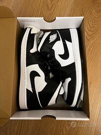 Nike Air Jordan 1 Mid bianche e nere