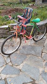 Bici da adulto con seggiolino posteriore