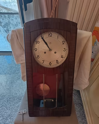 raffinato orologio a pendolo 