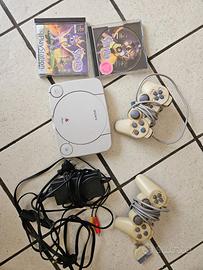 Playstation 1 con giochi, cavi e memory card