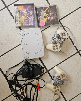 Playstation 1 con giochi, cavi e memory card
