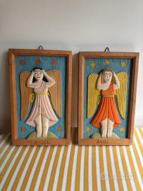 Coppia di angeli scolpiti nel legno