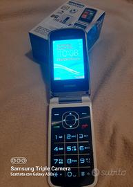 Telefono BRONDI con auricolari e caricabatteria.