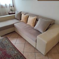 Divano letto con penisola e contenitore