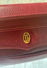Must di Cartier Pochette Vintag in pelle  bordeaux