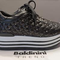 Sneaker Baldinini in pelle trapuntata con borchie