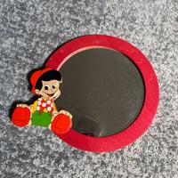 Specchio tondo in legno con pinocchio