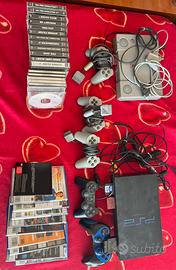 PlayStation 1 e 2 con accessori e giochi