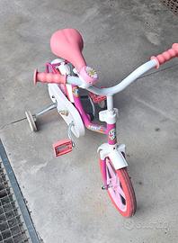 bicicletta bambina 12 pollici.con rotelle 