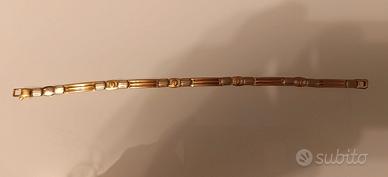 Braccialetto in oro giallo e bianco 18K
