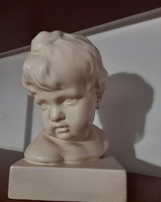 Busto di bambino in gesso lucido