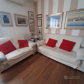 Coppia di divani in tessuto
