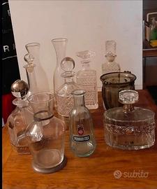 11 bottiglie antiche in vetro