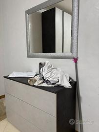 Camera da letto,cucina frigorifero e lavatrice.