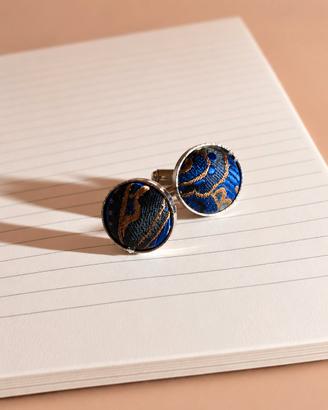 Gemelli in acciaio . inserti in tessuto blu e oro.