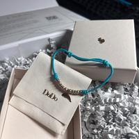 Bracciale Dodo con ciondolo delfino in oro rosa 9K