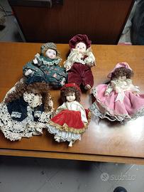 Lotto 5 bambole in porcellana vintage con abiti in