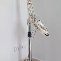 Lampada con lente per esterista