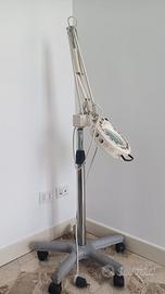 Lampada con lente per esterista