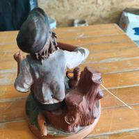 statue in terracotta con fischietto 