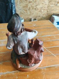 statue in terracotta con fischietto 