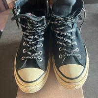 Converse alte da uomo.