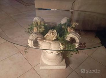 Tavolino di cristallo con base in pietra