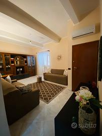 Bilocale con spazio esterno e posto auto