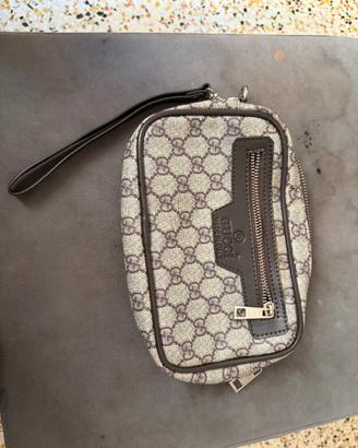 Clutch Gucci linea Ophidia GG Supreme.